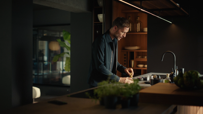 a man standing in a kitchen preparing food