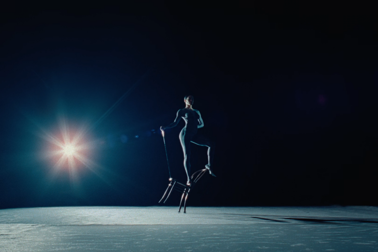 a woman standing on a pair of skis in the snow