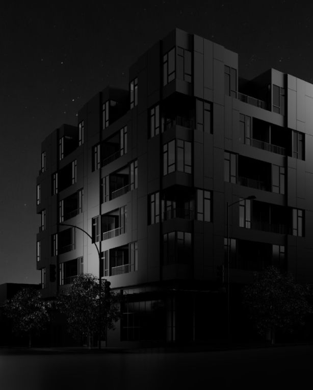 a black and white photo of a building at night