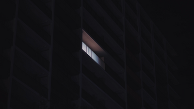 a window in the side of a building at night