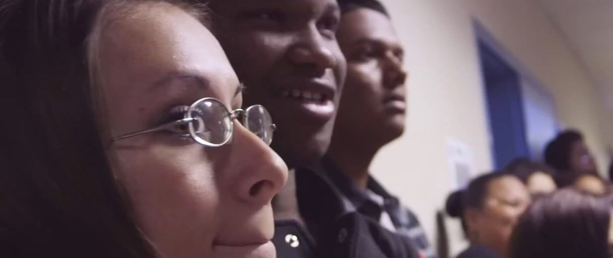 a group of people standing next to each other