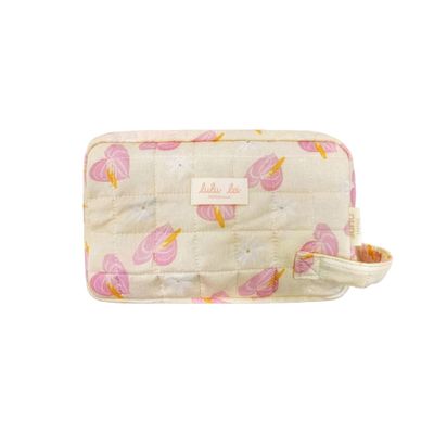 a white bag with pink and yellow butterflies on it