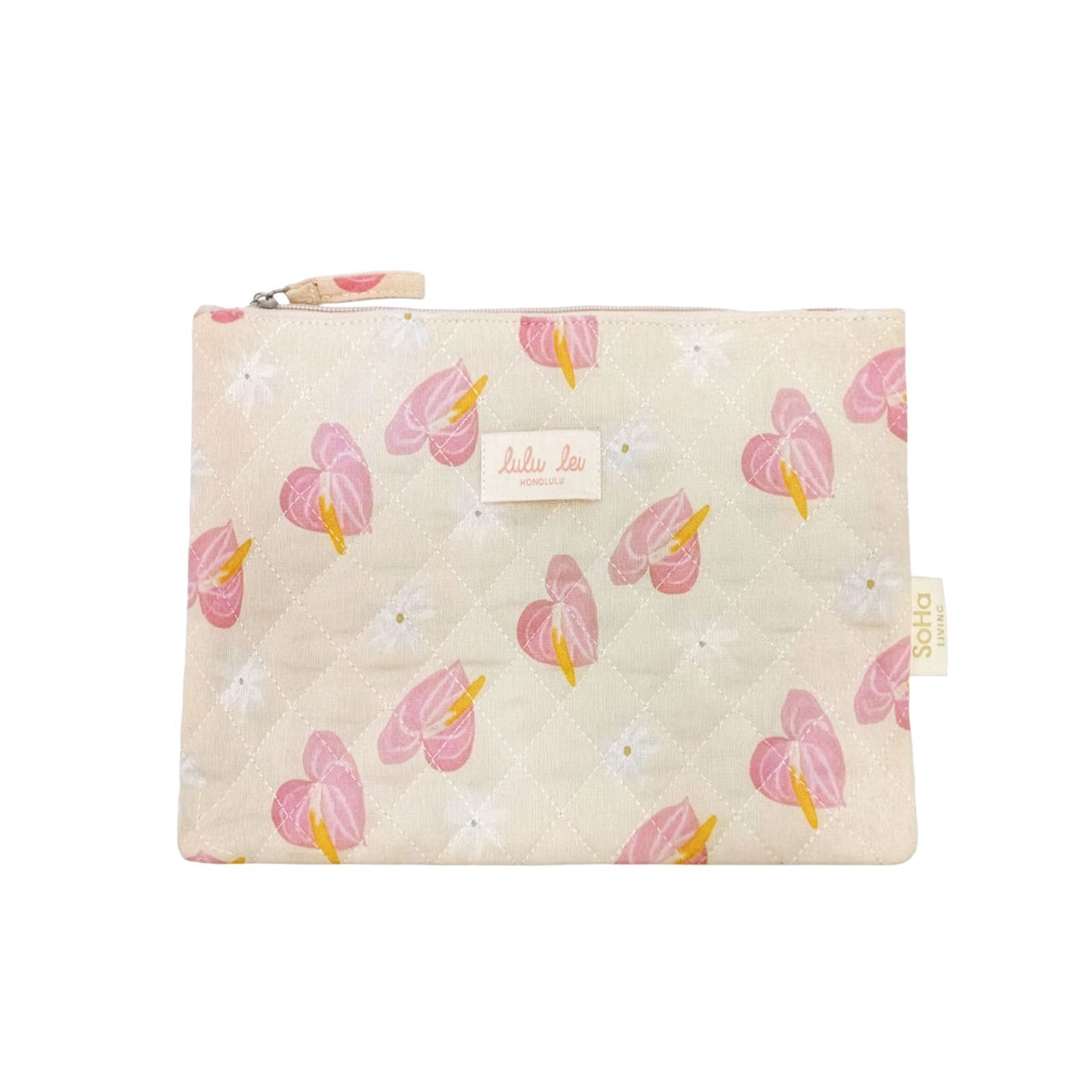 a small pink and yellow pouch with hearts on it