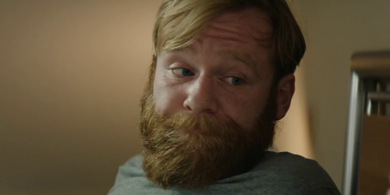 a close up of a man with a beard