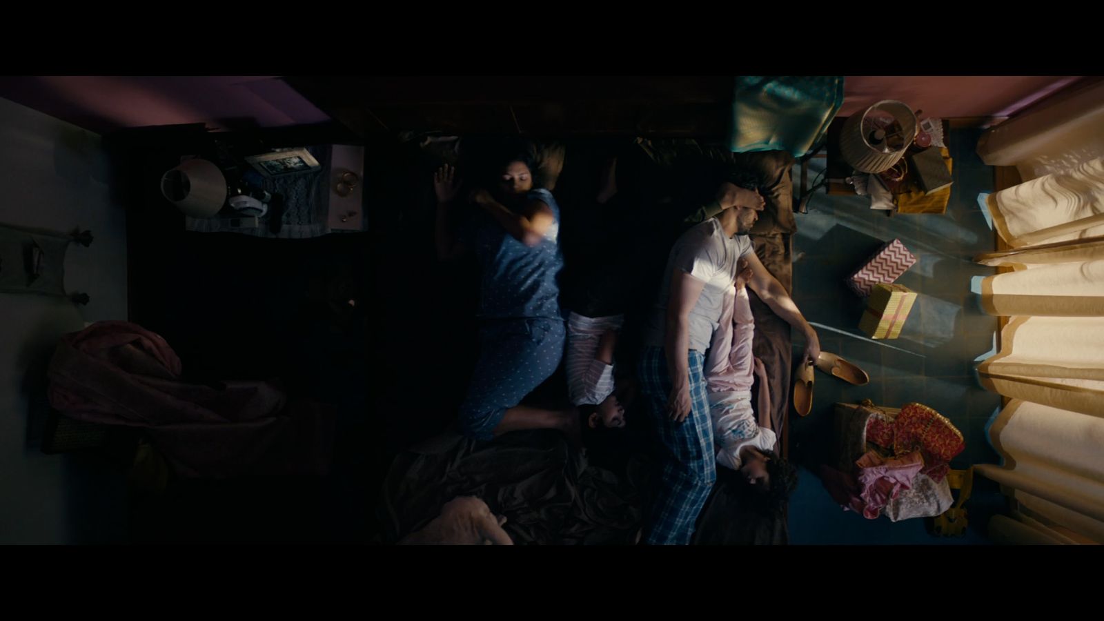 a group of people standing around a kitchen