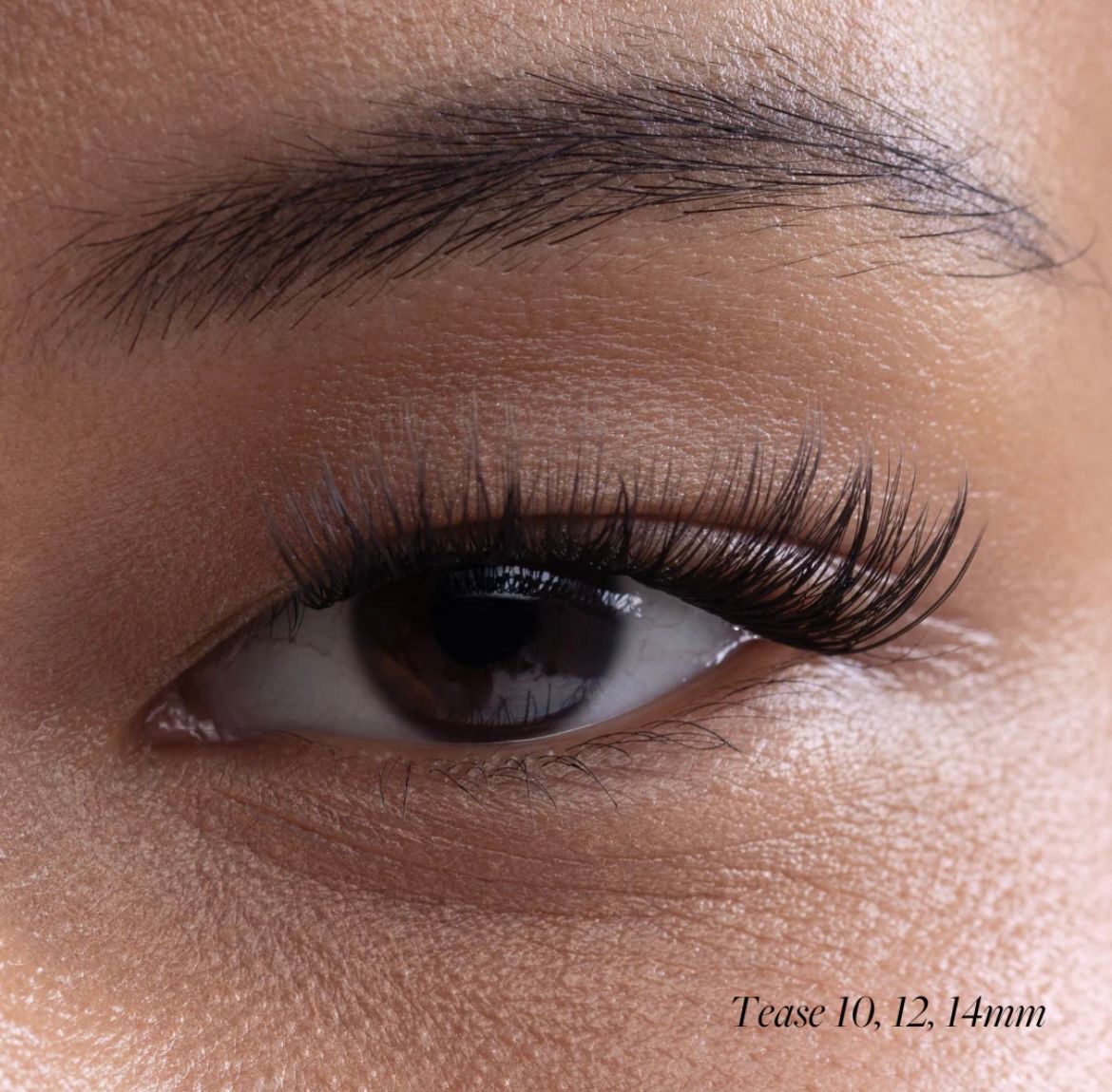 a close up of a woman's eye with long lashes