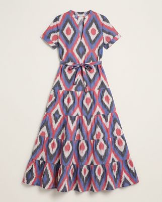 a blue and red dress with a bow at the waist
