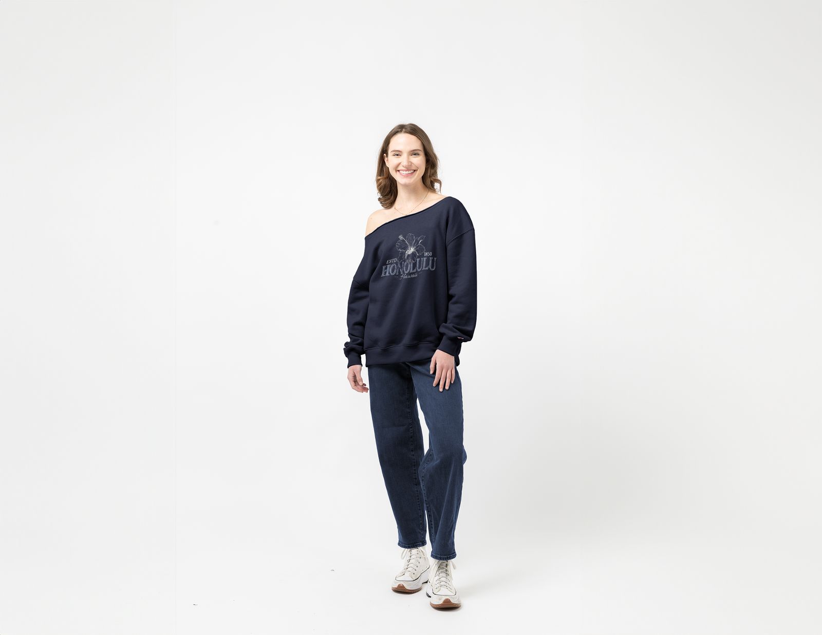 a woman standing in front of a white background
