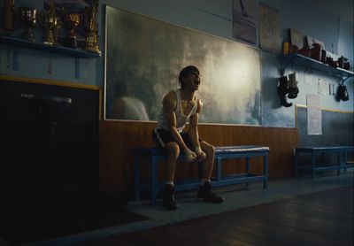 a man sitting on a bench in a room