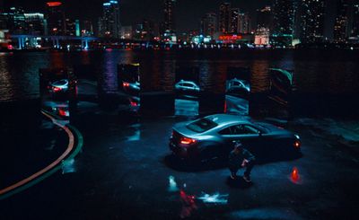 a couple of cars parked next to each other in a parking lot