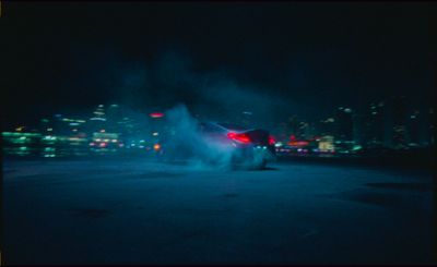 a car in a parking lot at night