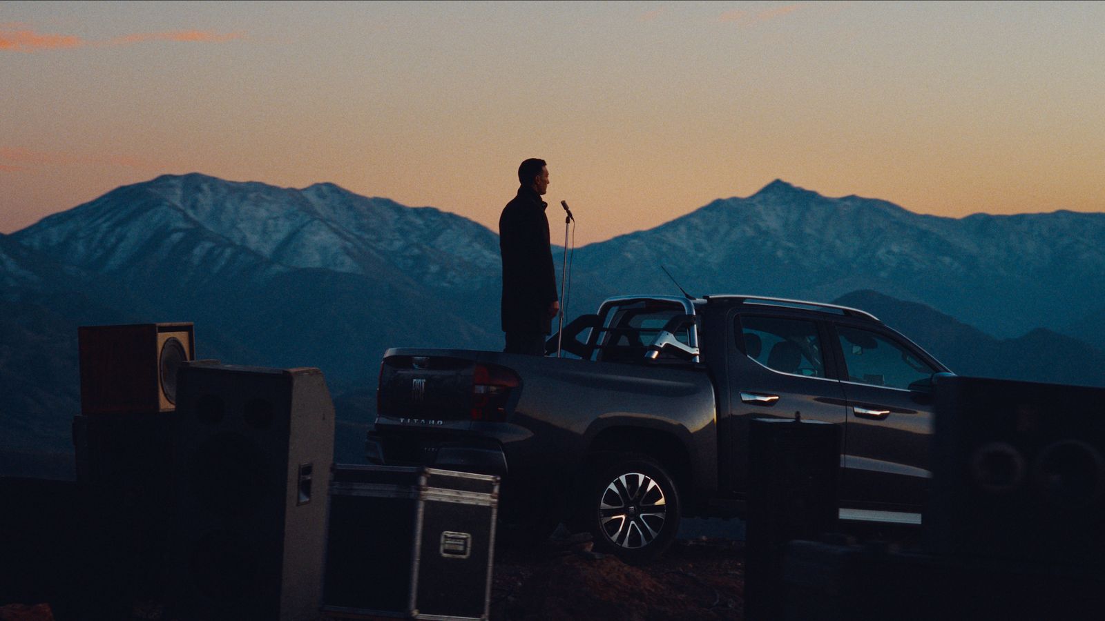 a man standing on top of a truck