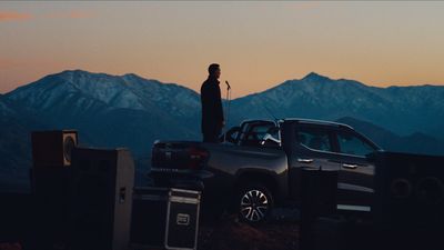a man standing on top of a truck