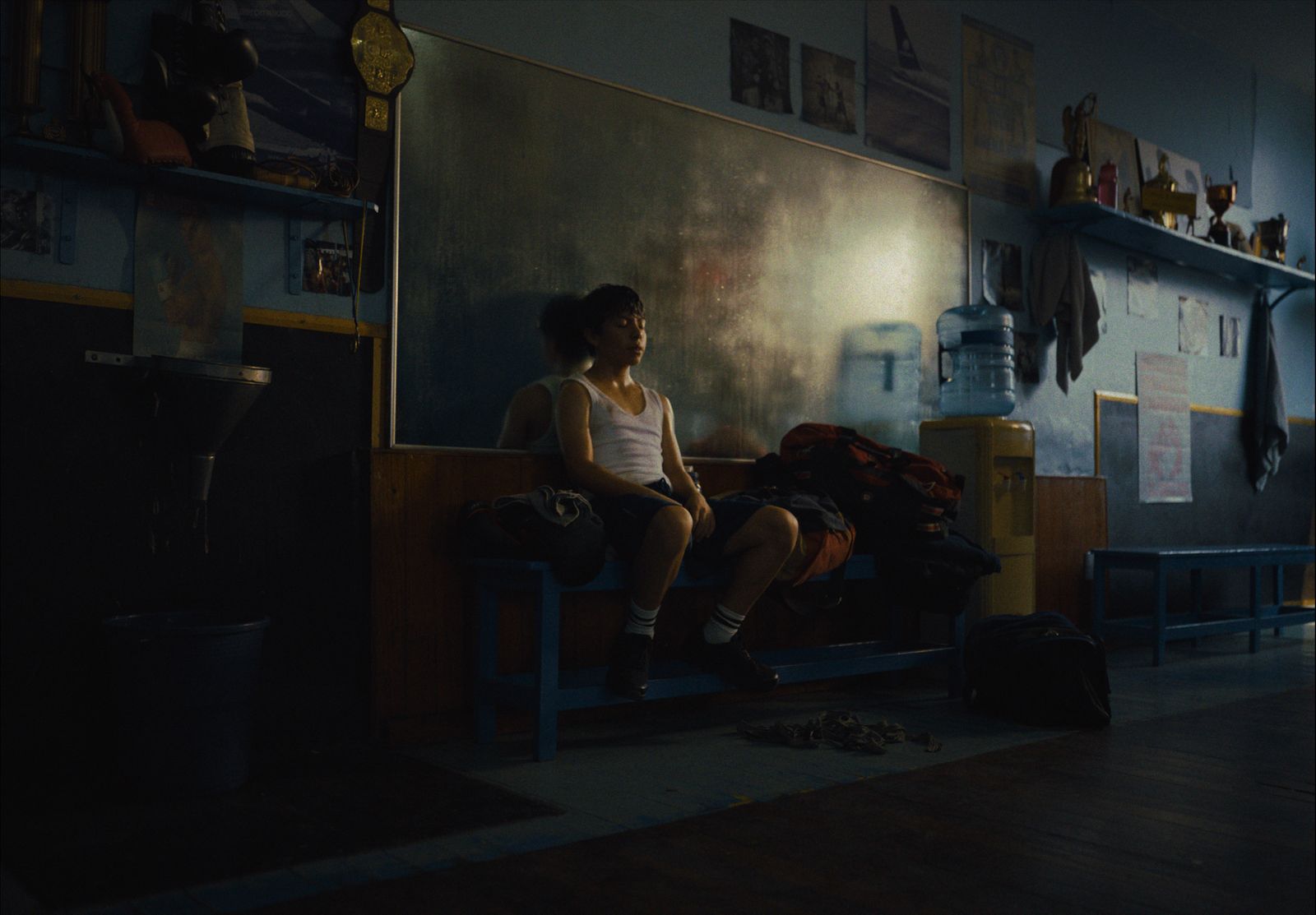 a woman sitting on a bench in a room