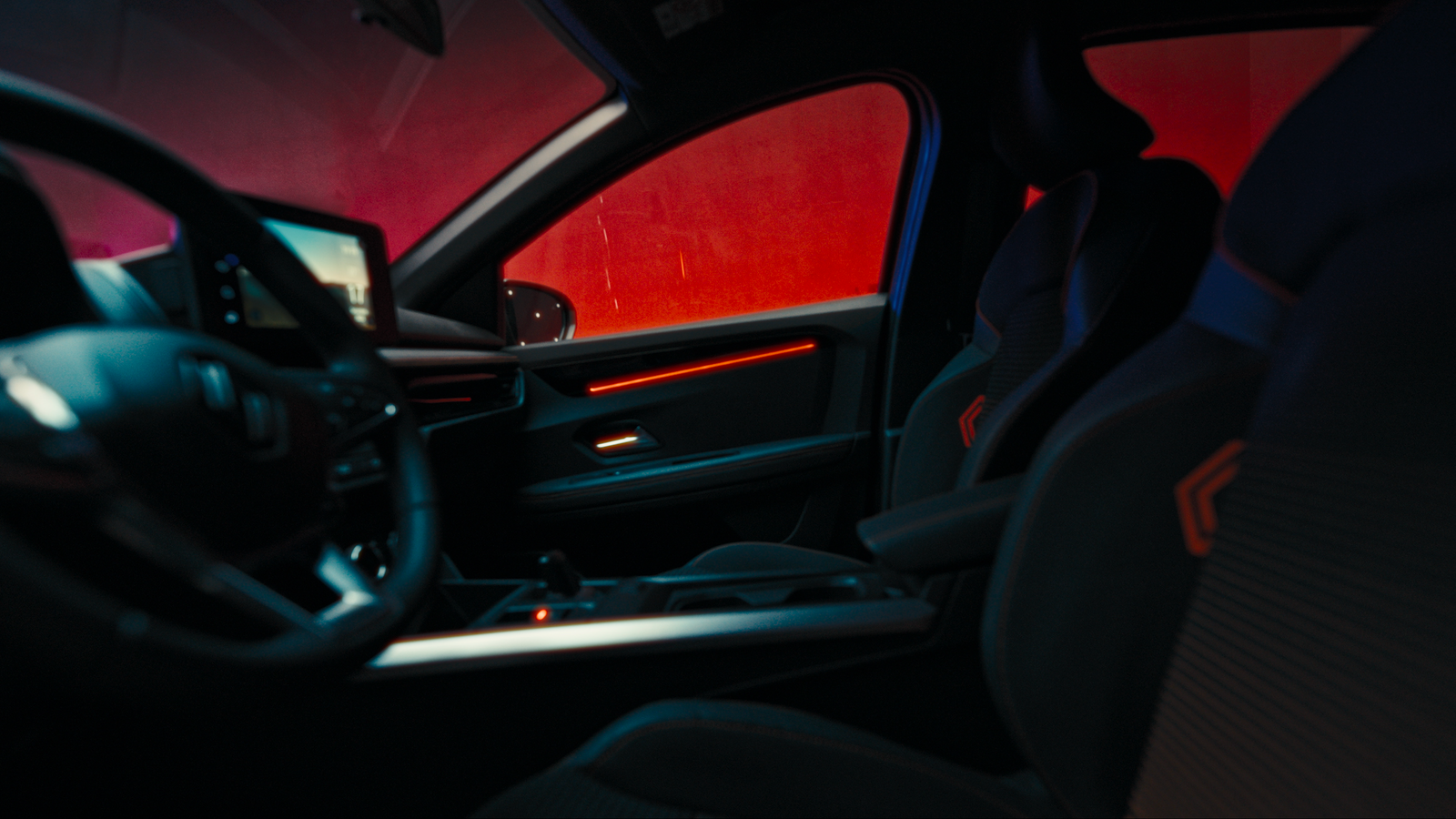 the interior of a car with a red light