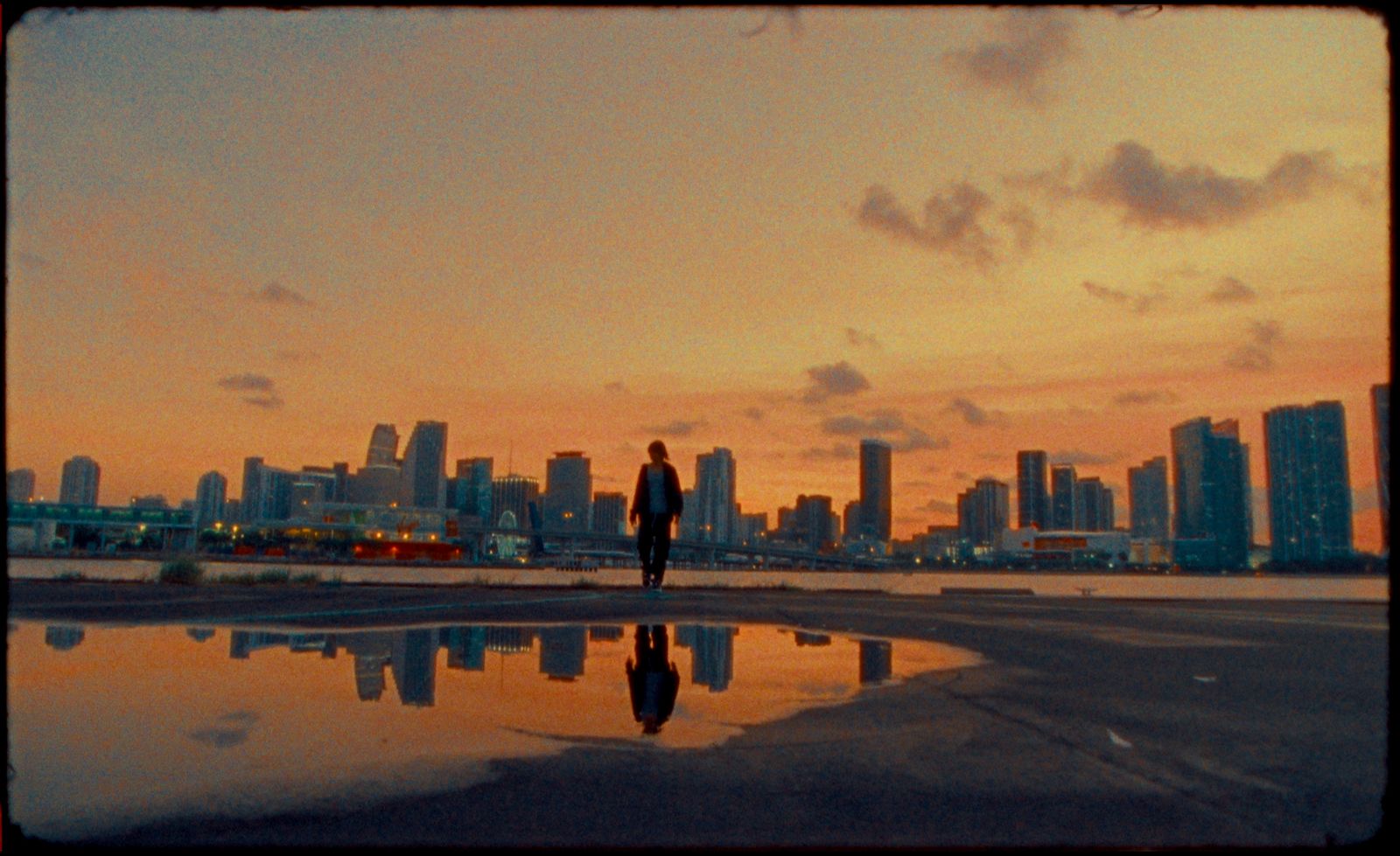 a person standing in front of a body of water