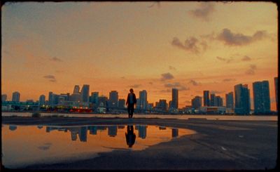 a person standing in front of a body of water