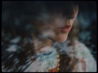 a close up of a woman's face through a window