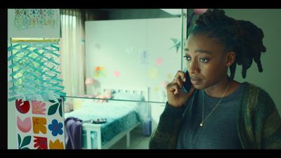 a woman talking on a cell phone in a room