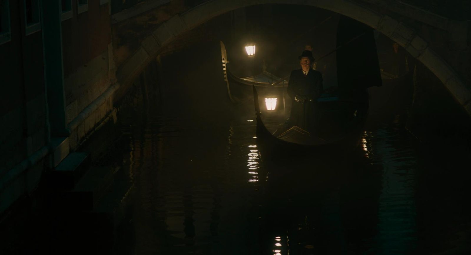 a person riding a gondola in the dark