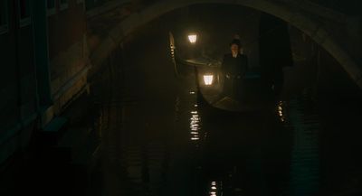 a person riding a gondola in the dark