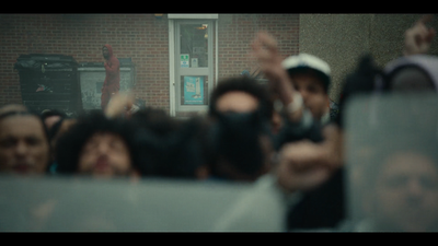 a group of people standing in front of a building