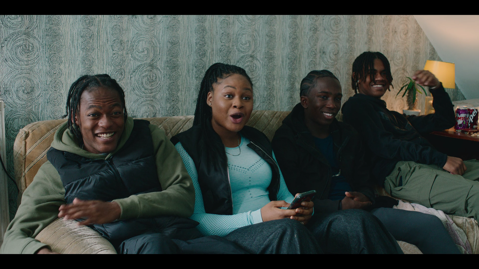 a group of people sitting on top of a couch