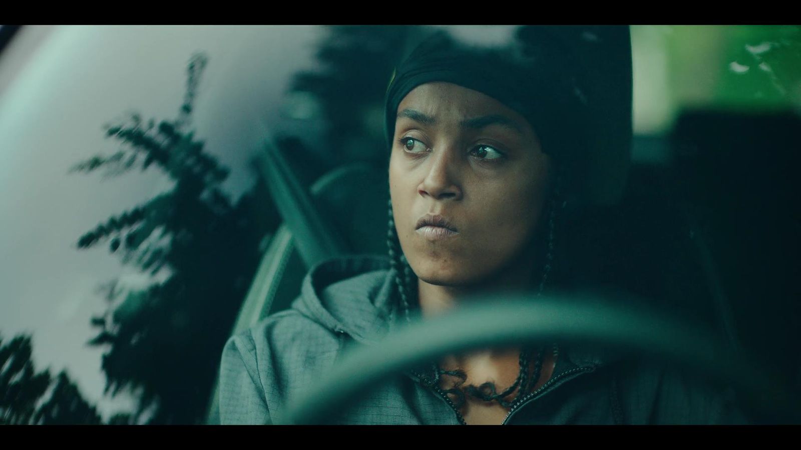 a woman sitting in the passenger seat of a car