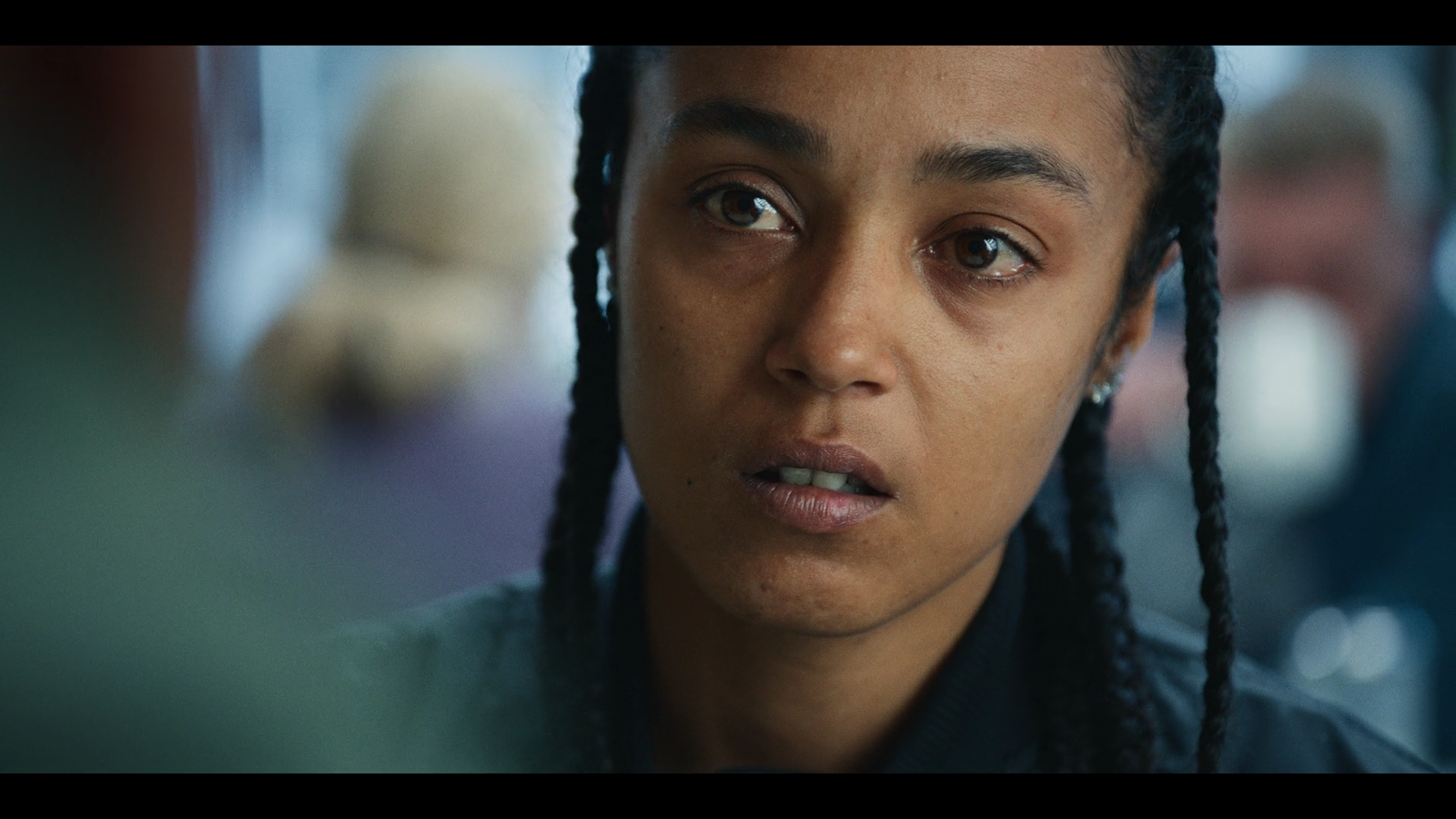 a close up of a person with dreadlocks