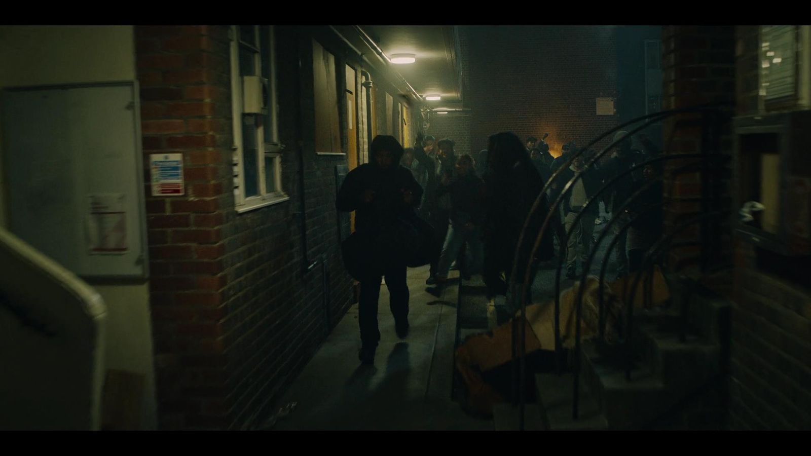 a group of people walking down a hallway