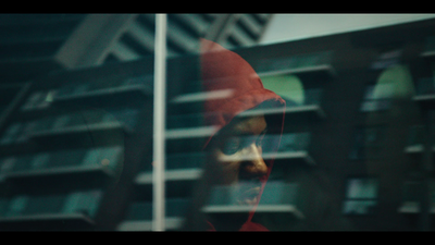 a blurry photo of a building with a red umbrella