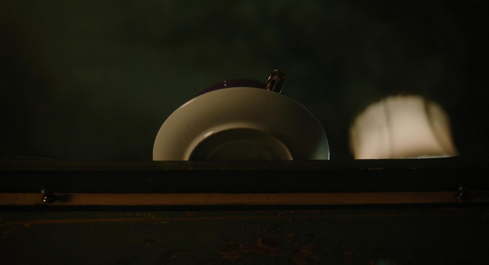 a white object sitting on top of a wooden table