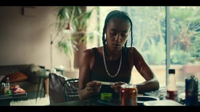 a woman sitting at a table with a plate of food