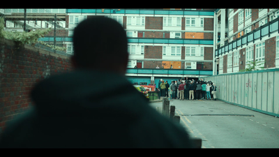 a group of people standing outside of a building