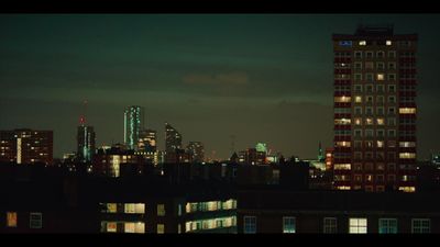 a view of a city at night from a rooftop