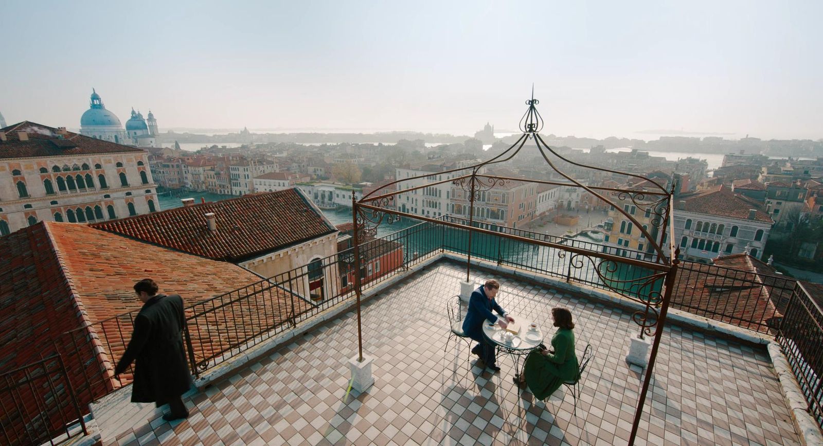 a group of people standing on top of a roof