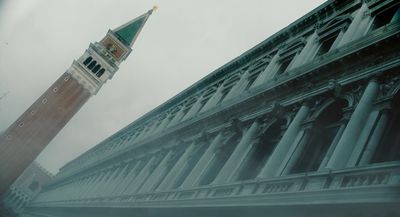 a tall clock tower towering over a city