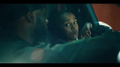 a woman sitting in the passenger seat of a car