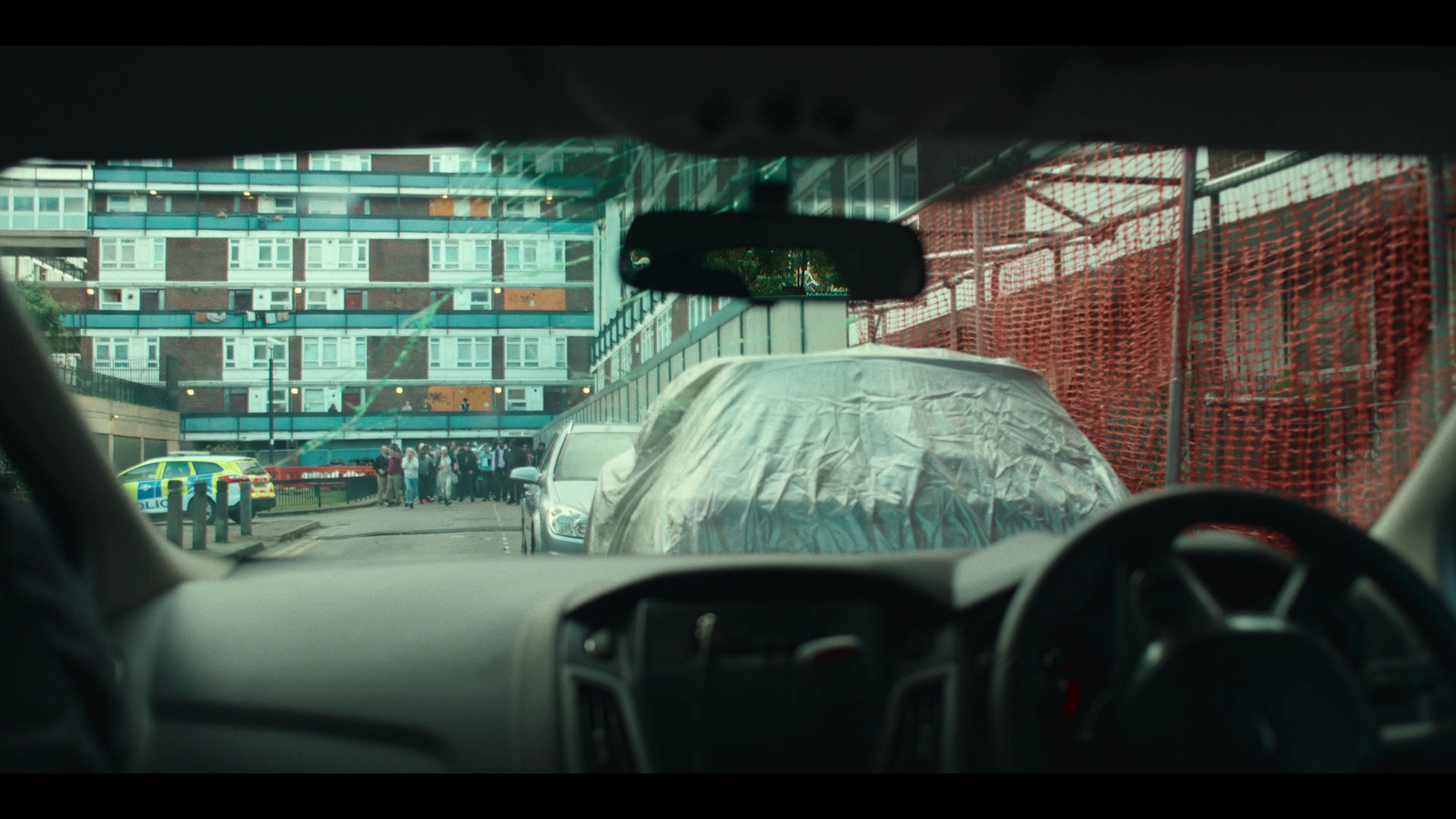 a view of a city street from inside a car