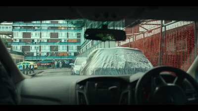 a view of a city street from inside a car