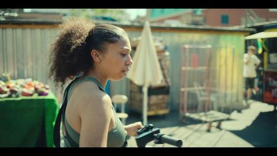 a woman with a bike on a city street