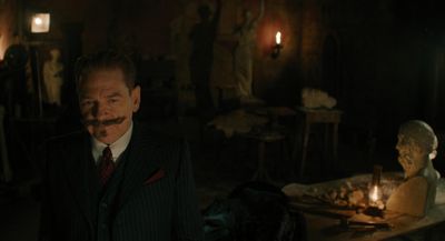 a man with a fake moustache standing in a dark room