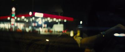 a blurry photo of a gas station at night