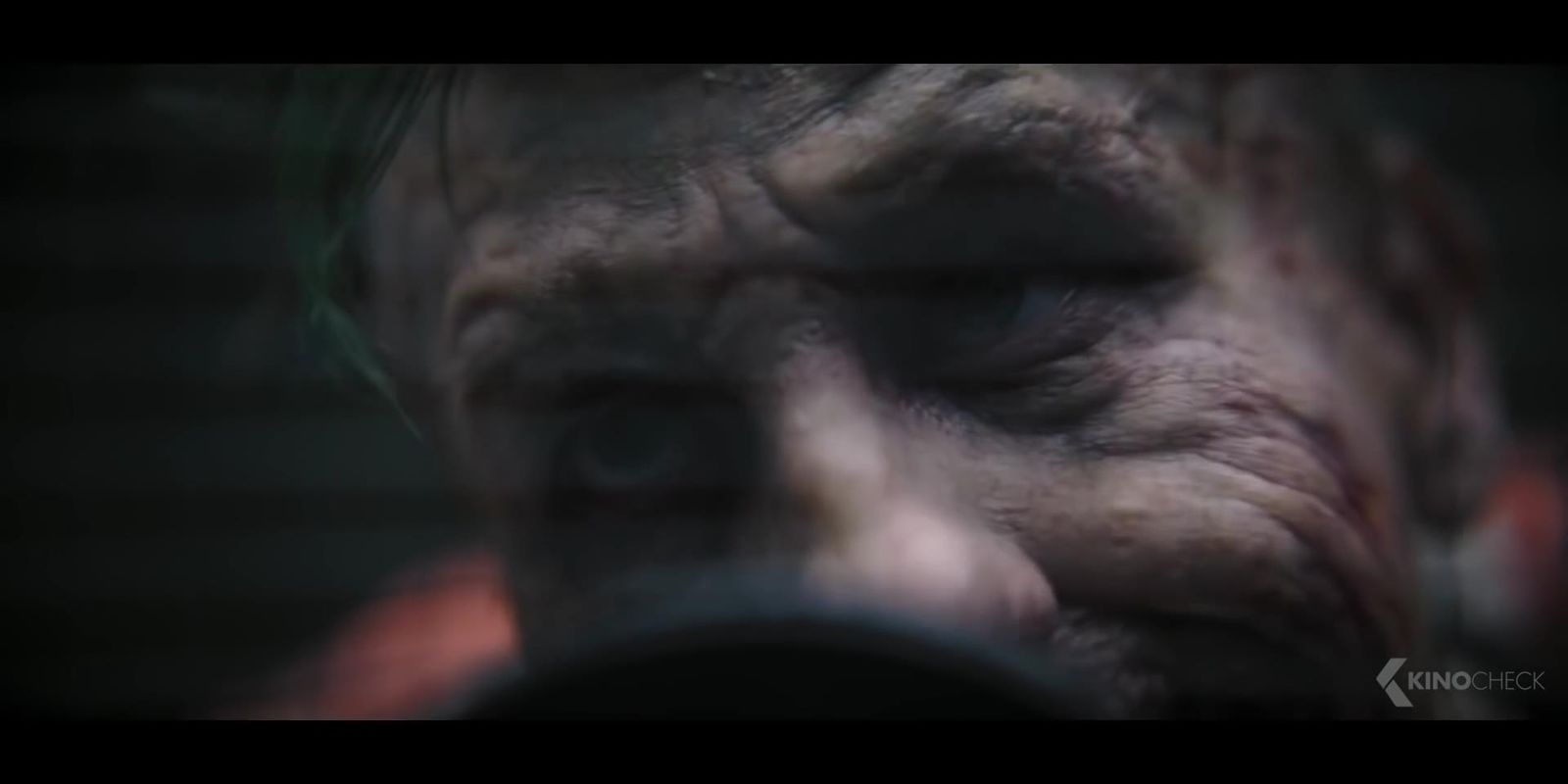 a close up of the face of a zombie