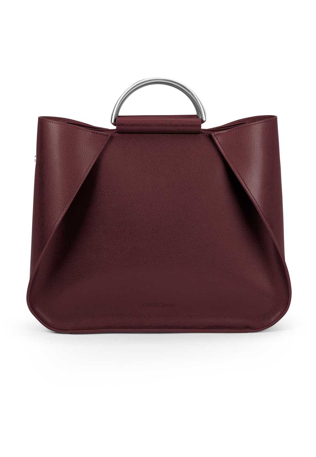 a red handbag with a metal handle
