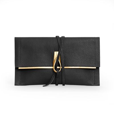 a black and gold clutch bag with a tie
