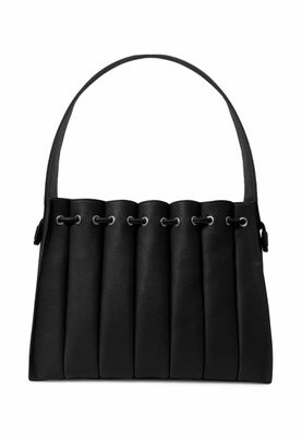 a black handbag with a long handle