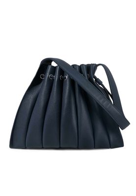 a blue handbag on a white background