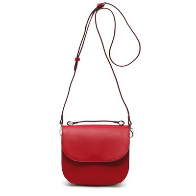 a red purse with a strap on a white background