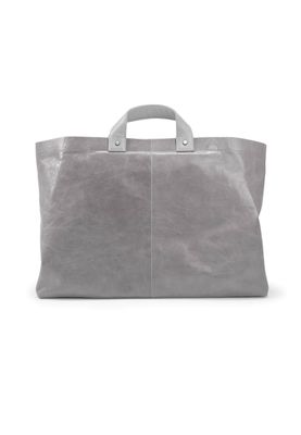 a gray leather bag on a white background